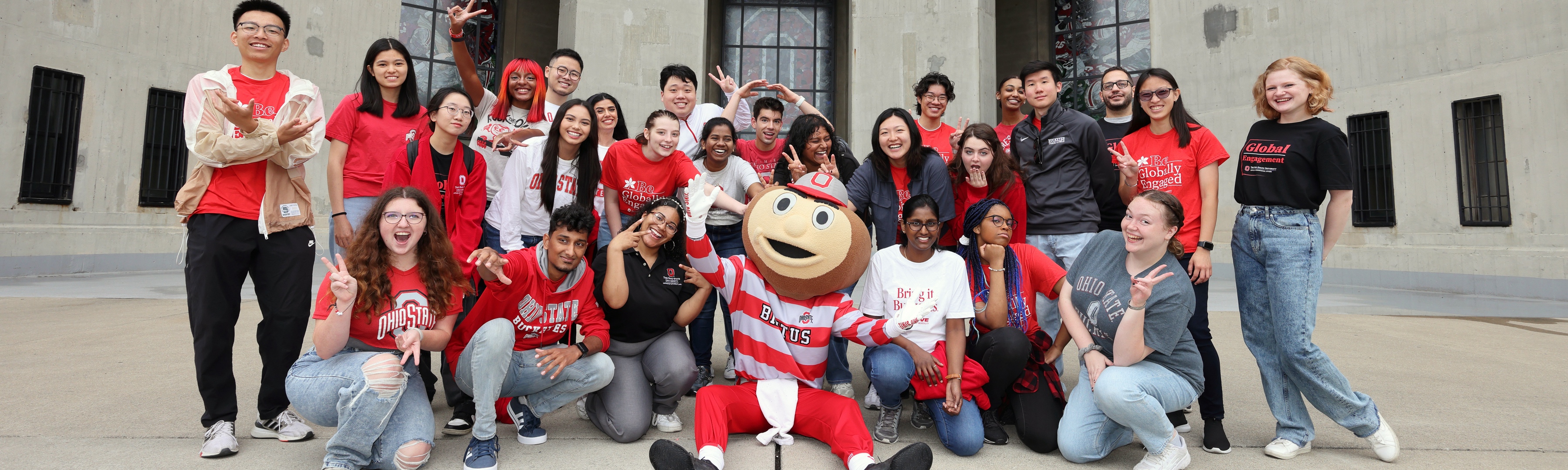 A group of students posing with Brutus in front of Ohio Stadium.