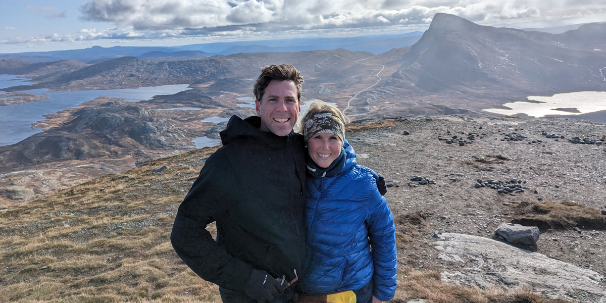 Two people on top of the mountain