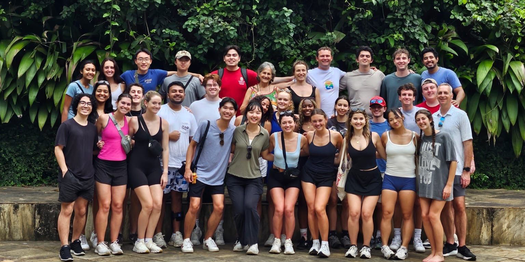 Group of students standing in front of foliage in Brazil