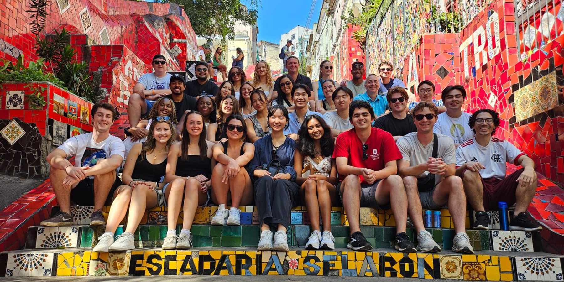 Group of students sitting on the mosaic stairs in Brazil