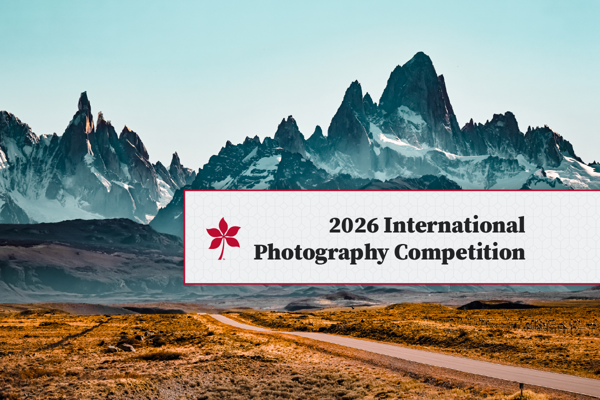 Graphic about photo competition overlayed on long view of mountains
