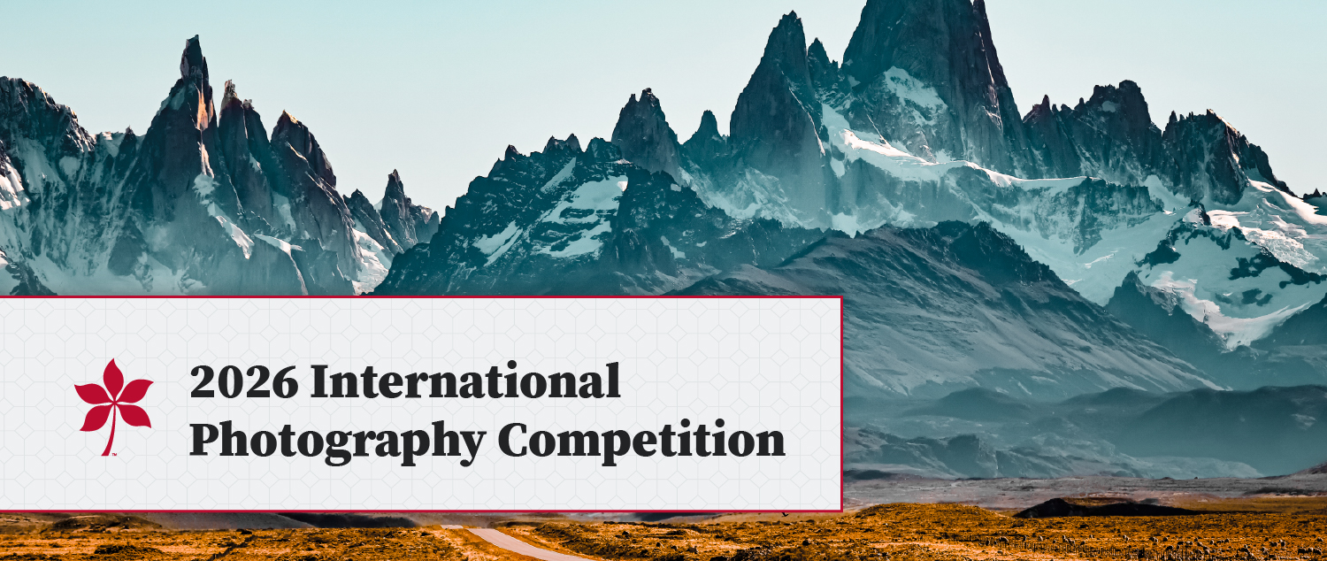 Graphic about photo competition overlaid on image of mountains