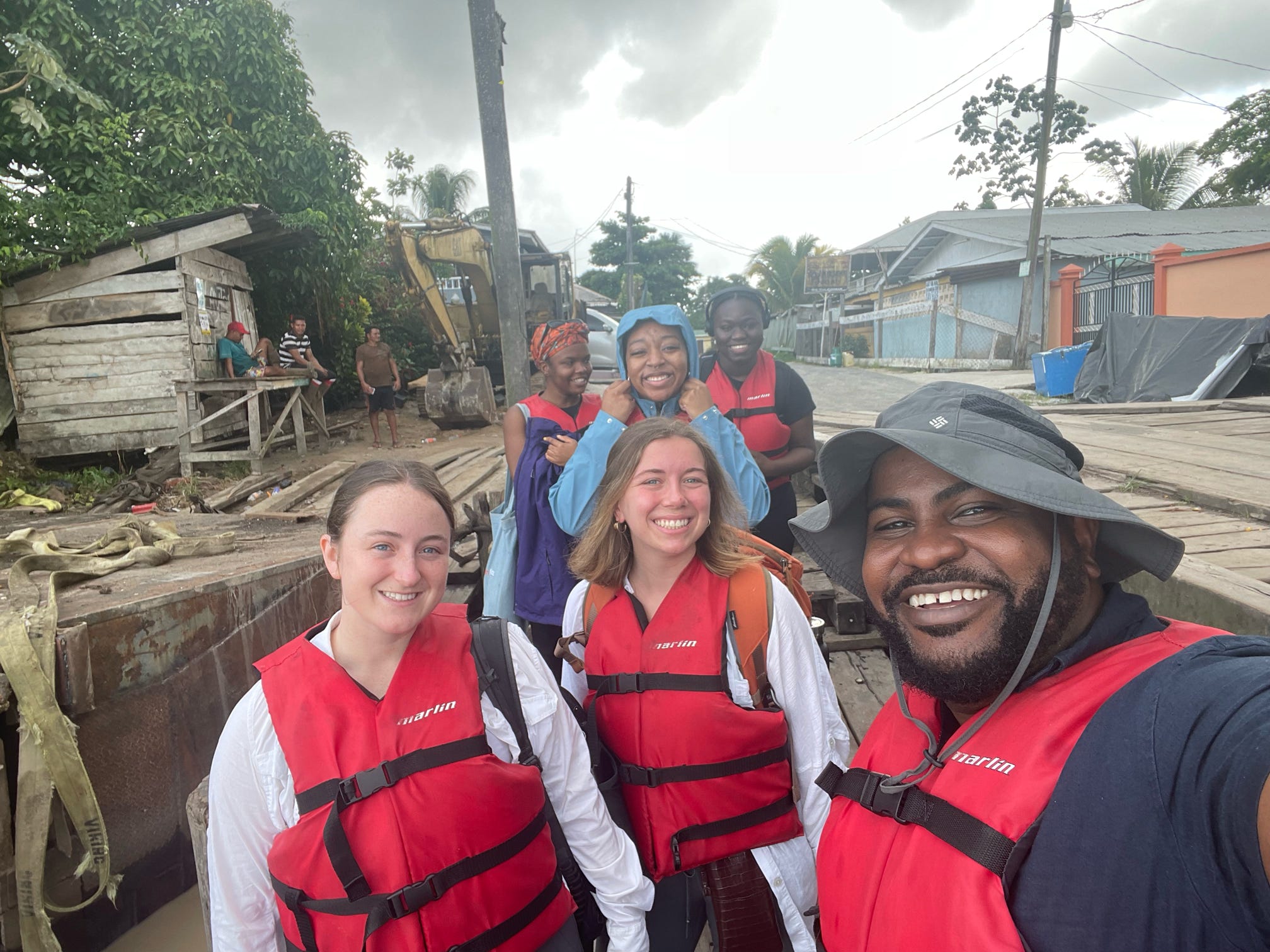 Students pose in life jackets in a Guyanan village