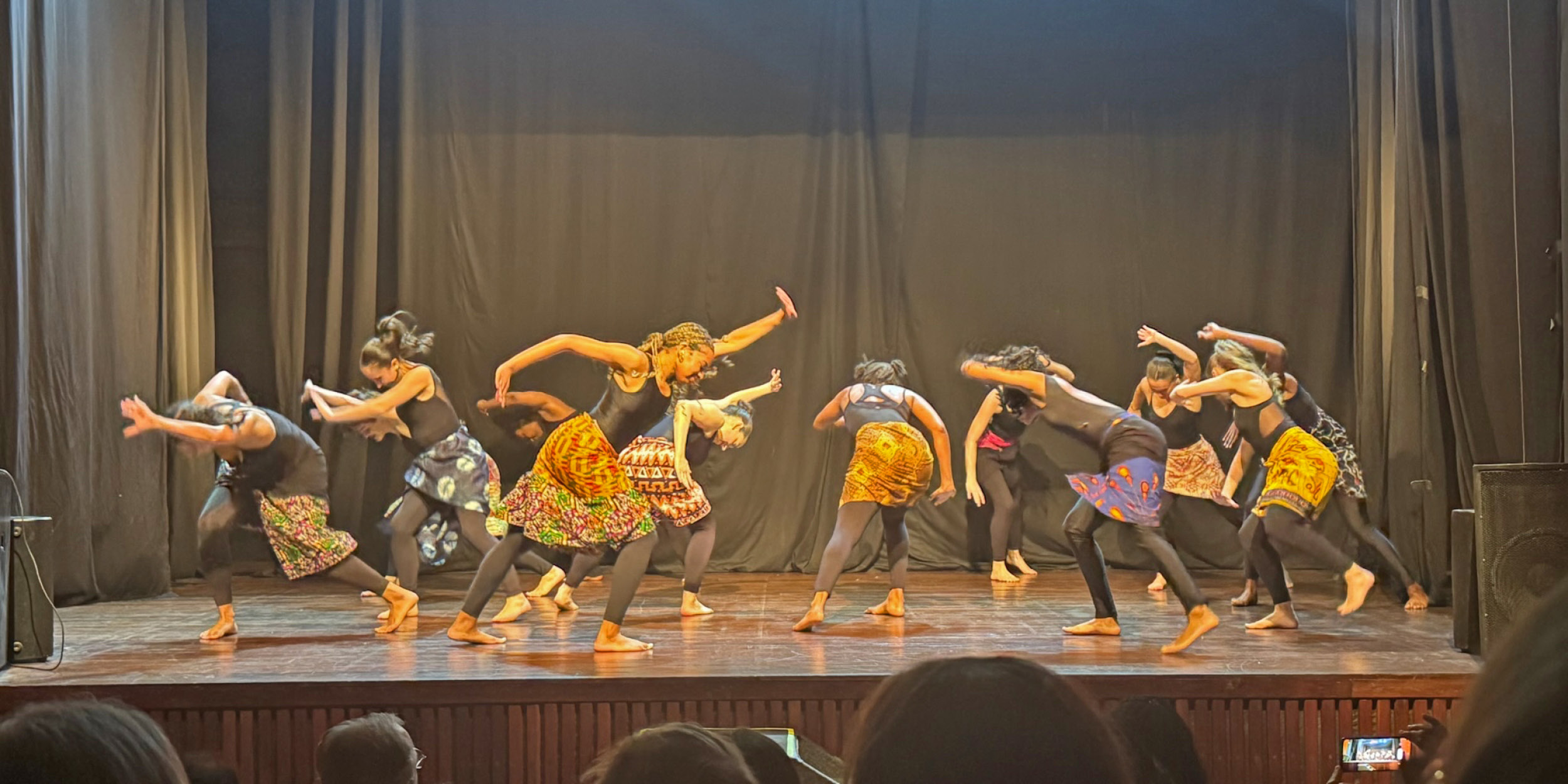 students dancing on a stage