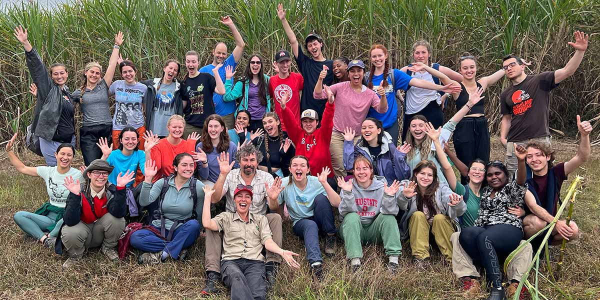 Students and professor in a field in Australia