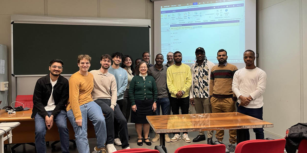 Group of students with a faculty member in a classroom