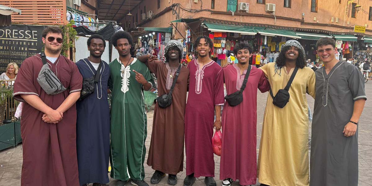 Students posing in traditional garb in Morocco