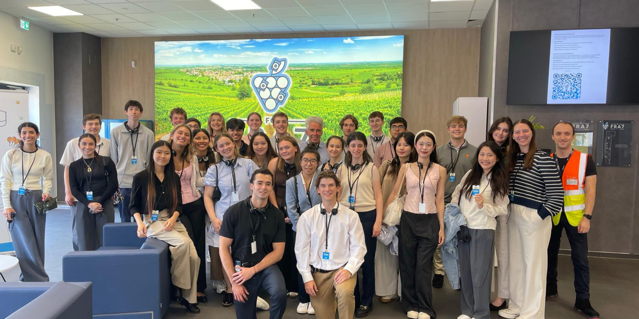 students posing in an office