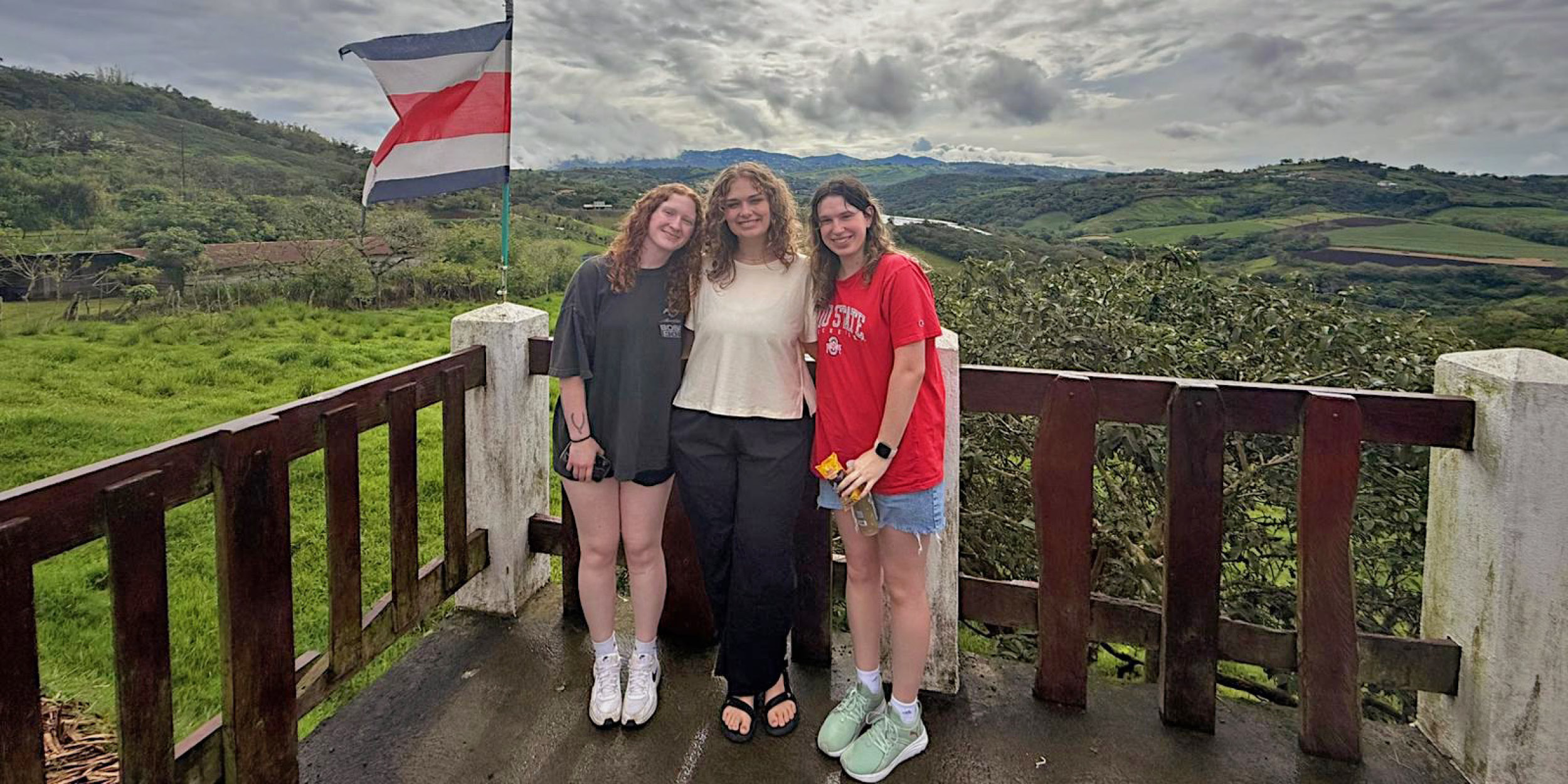 students standing in front of a costa rican countryside