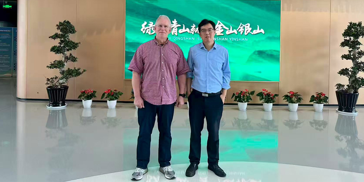 Zirkle and colleague in lobby of school