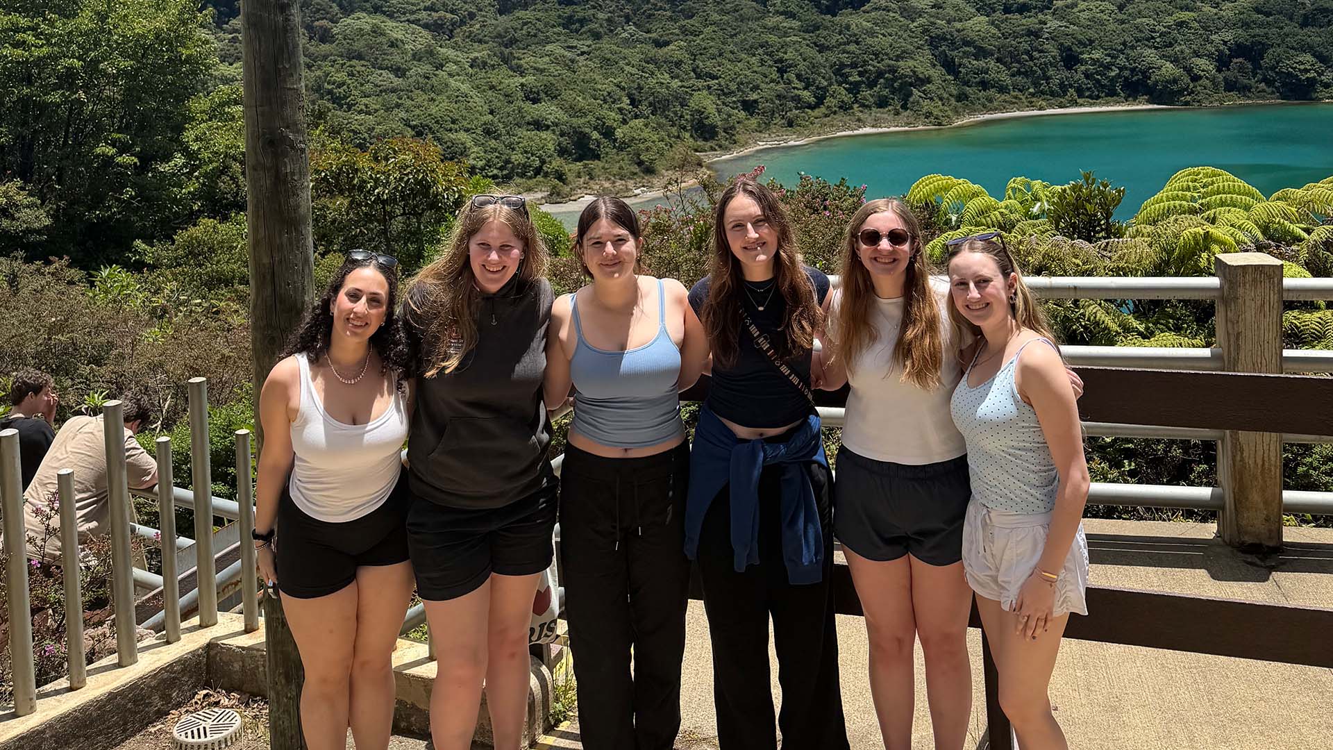 Students posing near lake