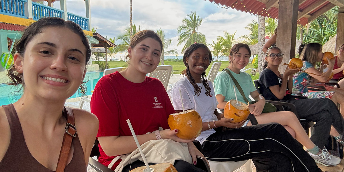 Students drinking coconut water
