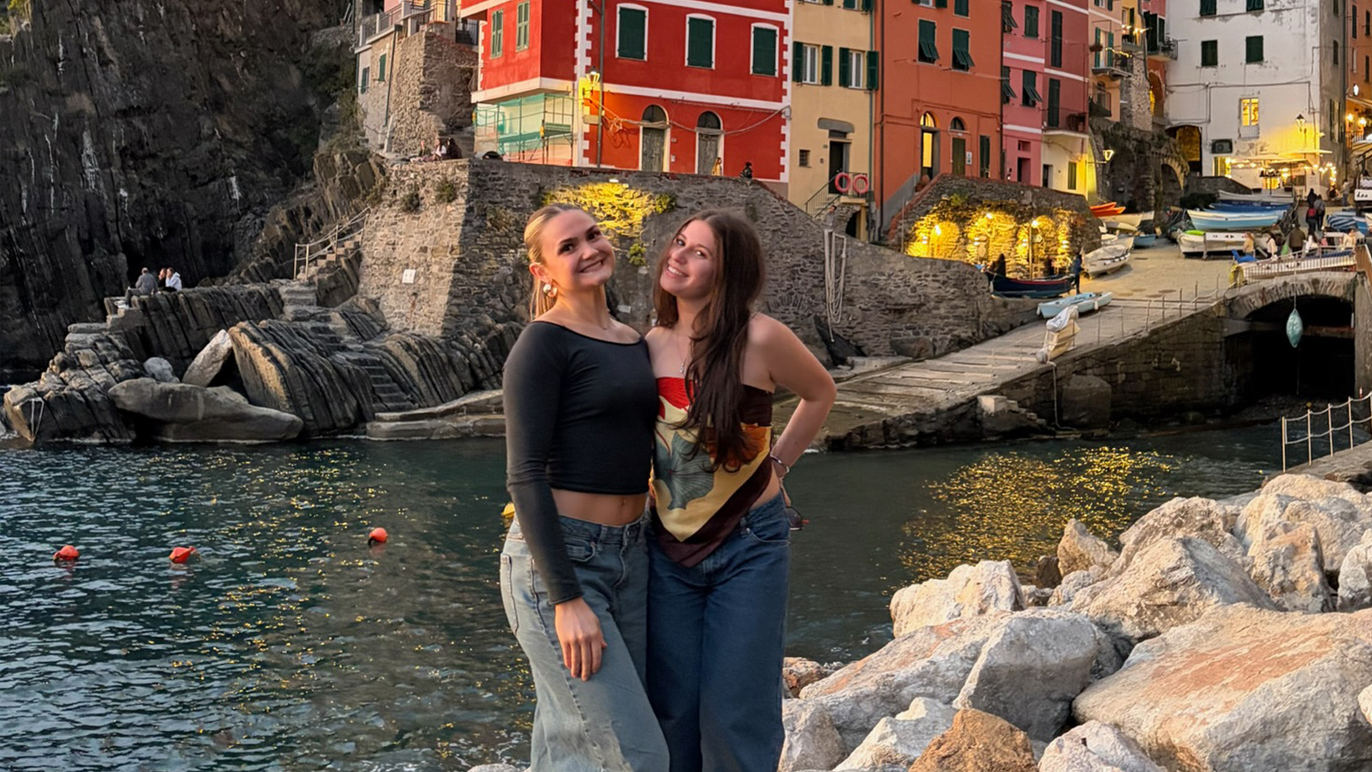 Students posing on a coastline