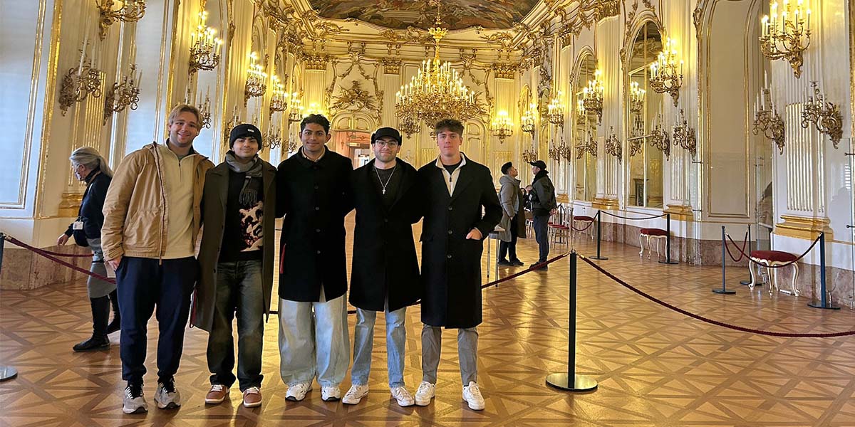 students posing in a museum