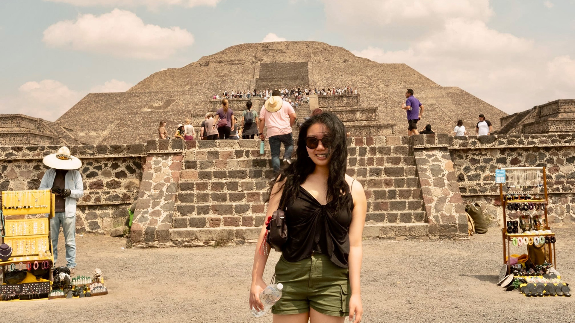 Student in front of monument