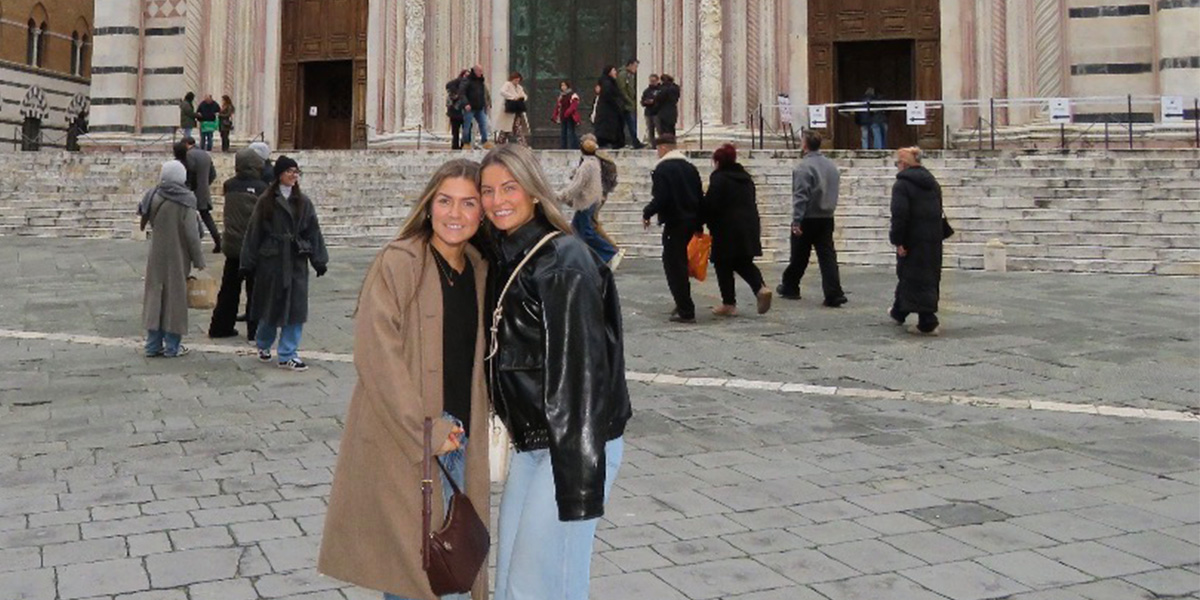 Students in front of building in Italy