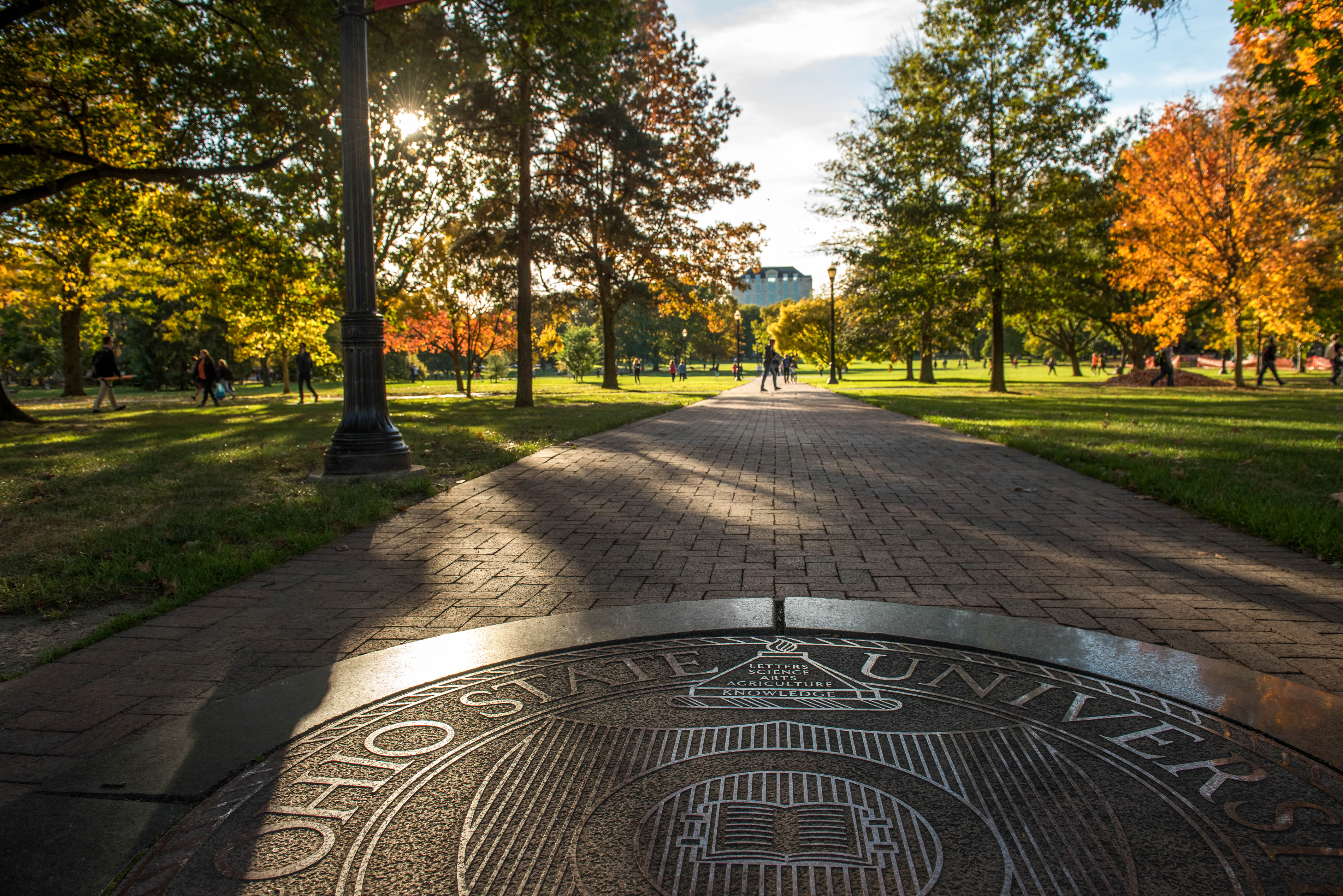 Ohio state seal on the oval surrounded with autumnal trees