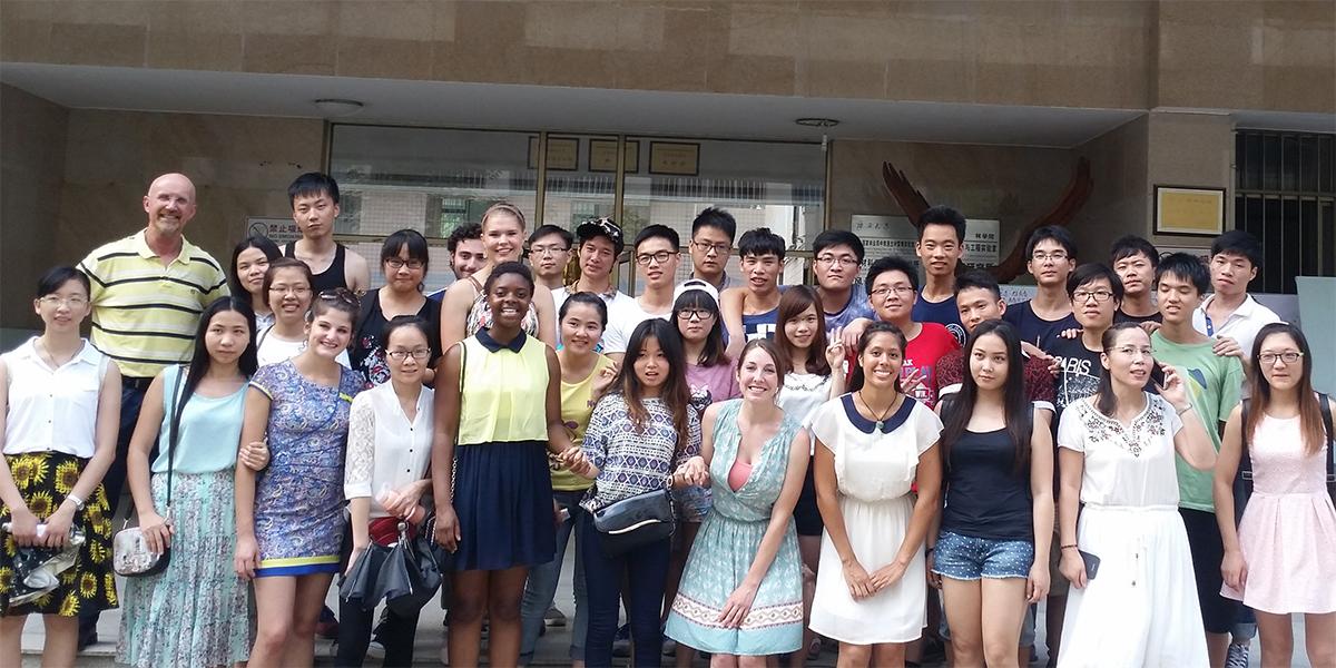 Roger Williams with students in China