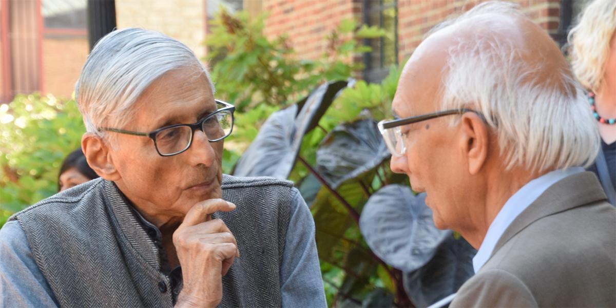 Rajmohan Gandhi chats with Rattan Lal on a sunny day