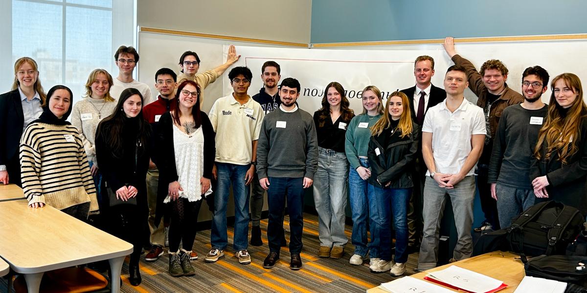 Group of student pose in a classroom