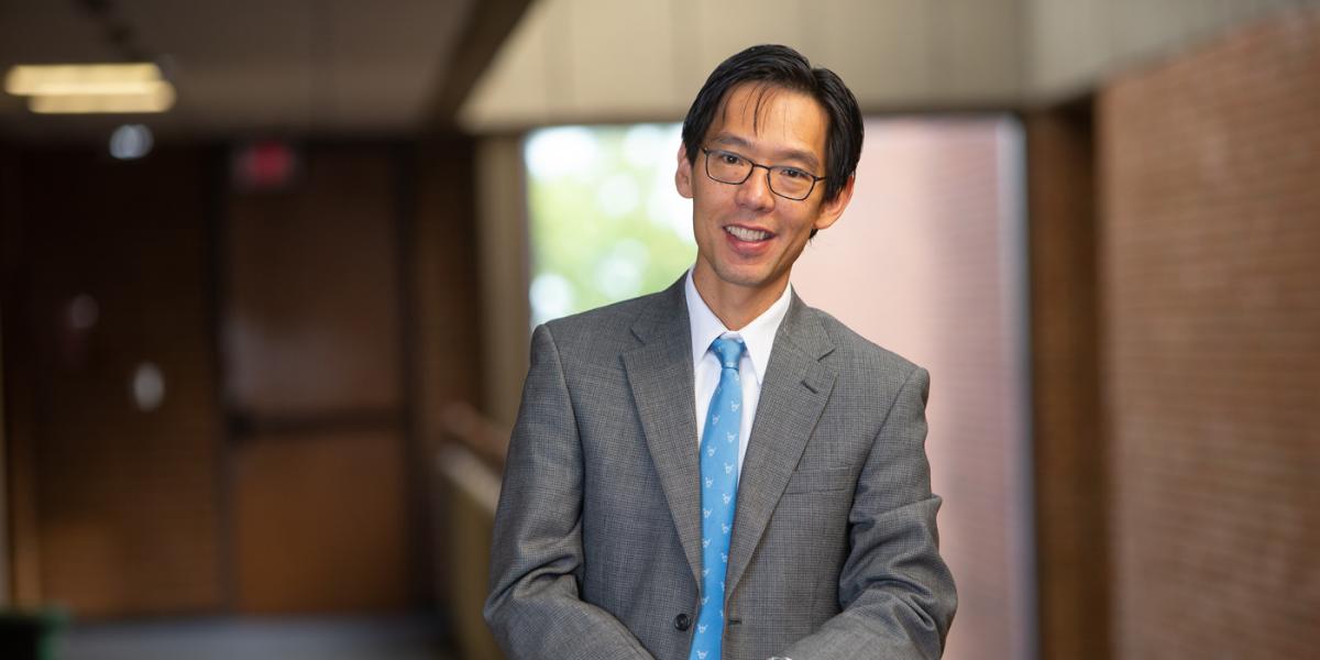 Male wearing glasses and suit 