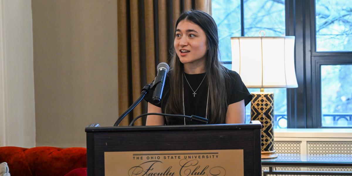 Female speaking at podium