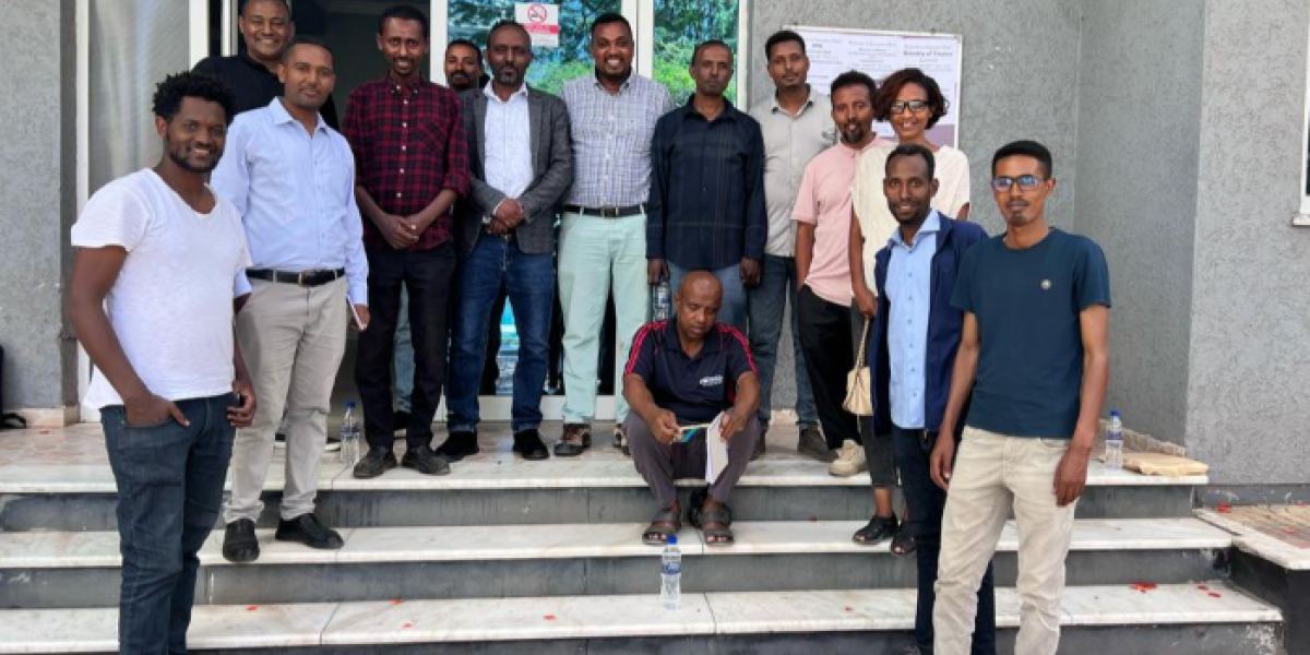Group of healthcare professions in front of building in Ethiopia