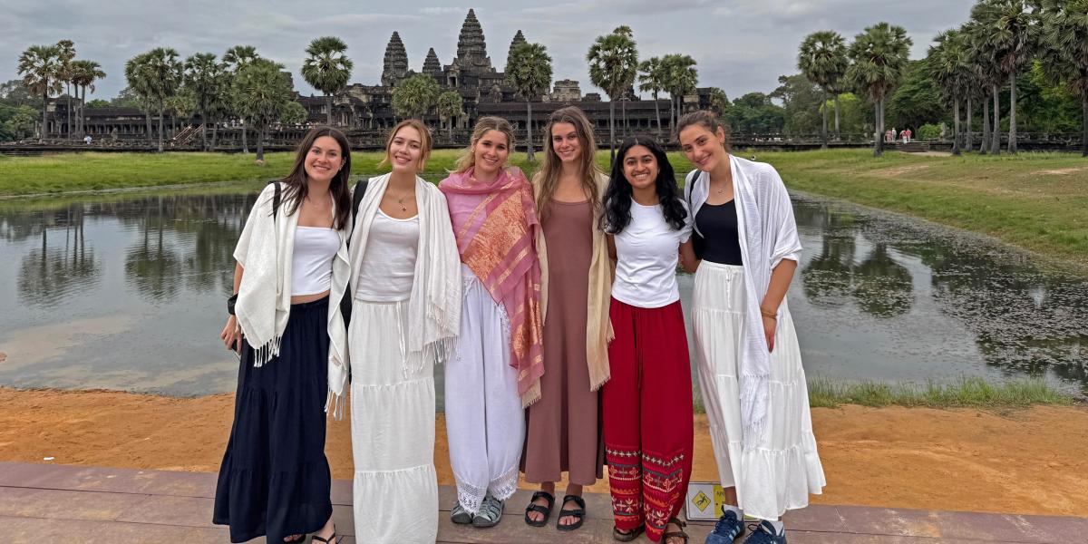 students in front of castle in Cambodia