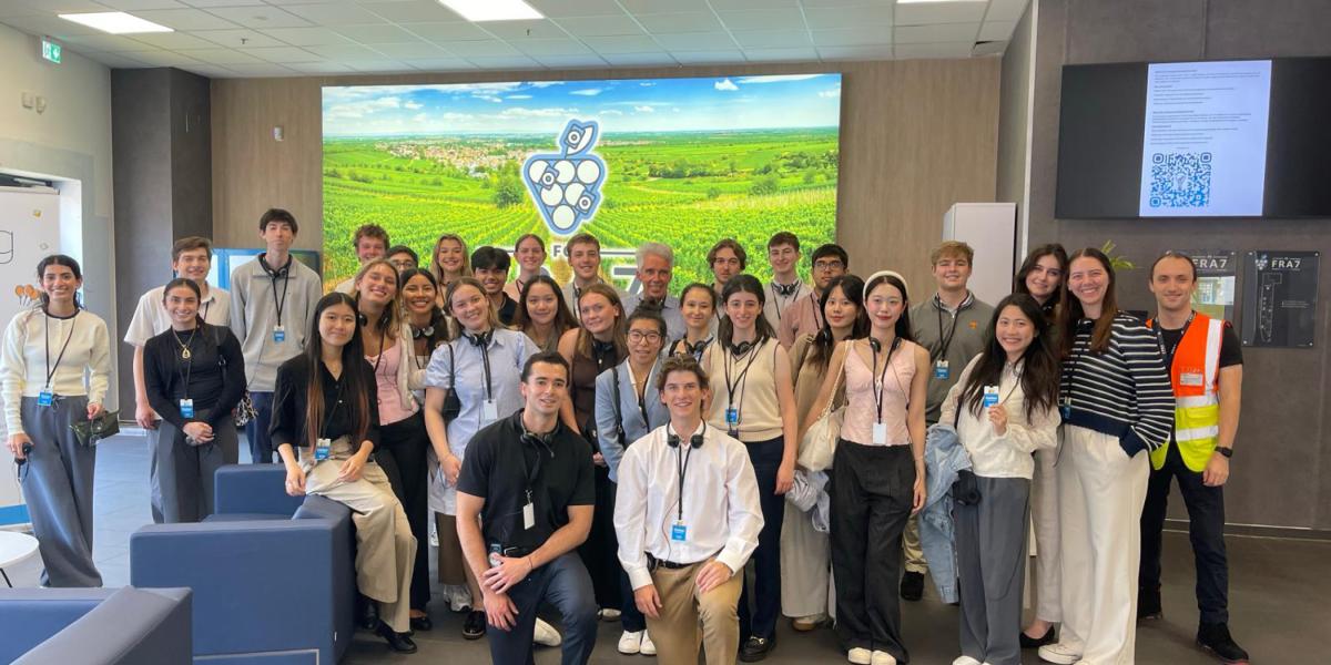 students posing in an office