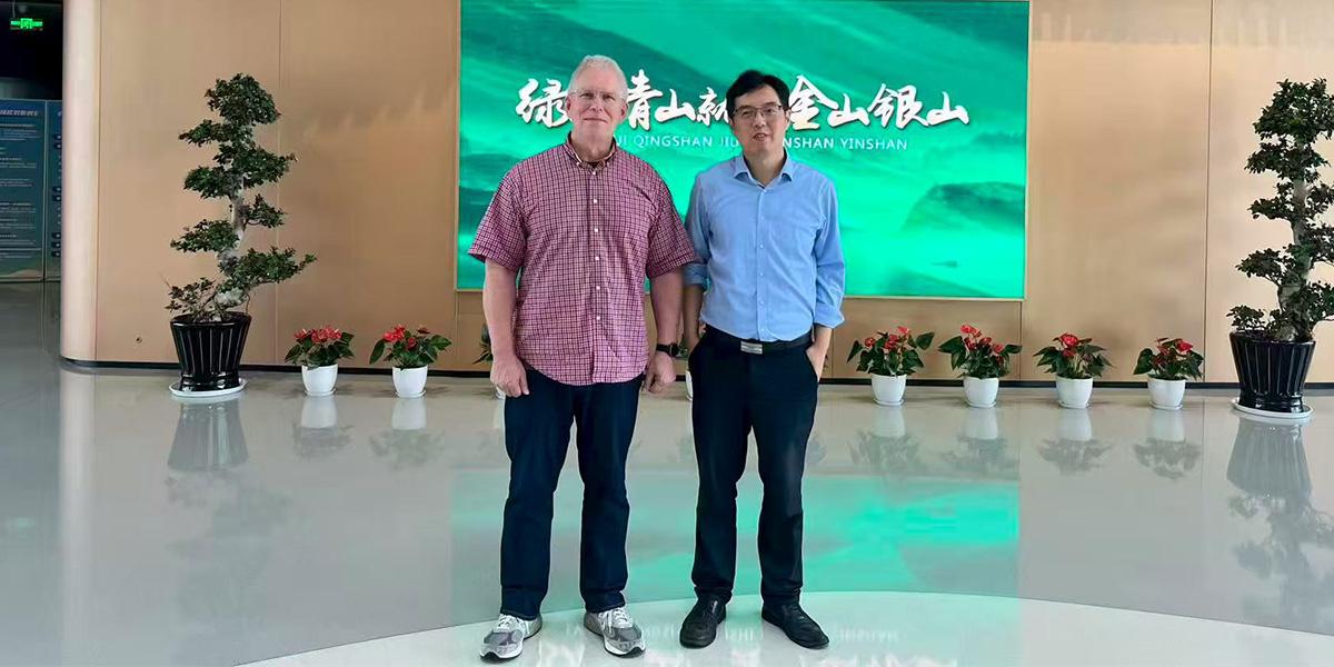 Zirkle and colleague in lobby of school