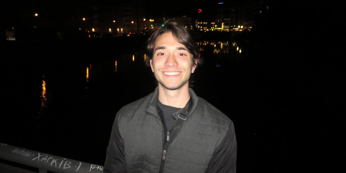Student near dark bridge