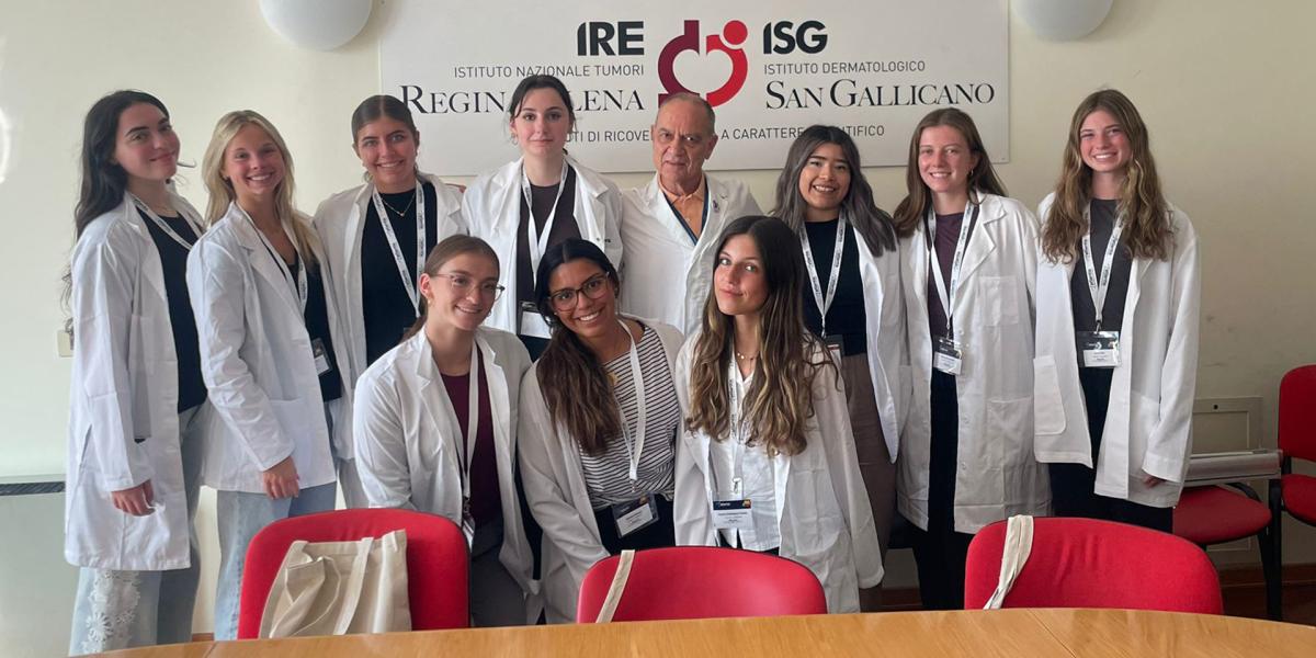 Group of students and doctors in white coats