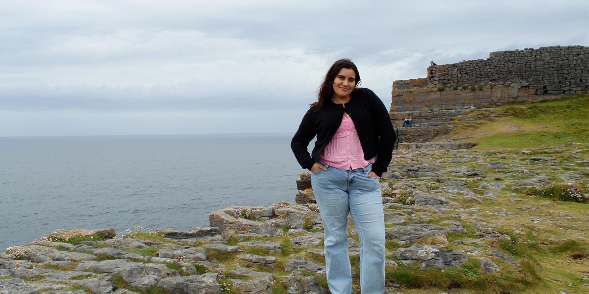 Student on rocky coast in Ireland