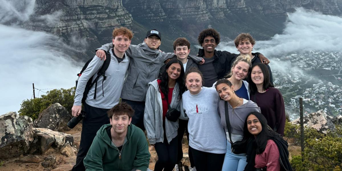 Students posing near mountain