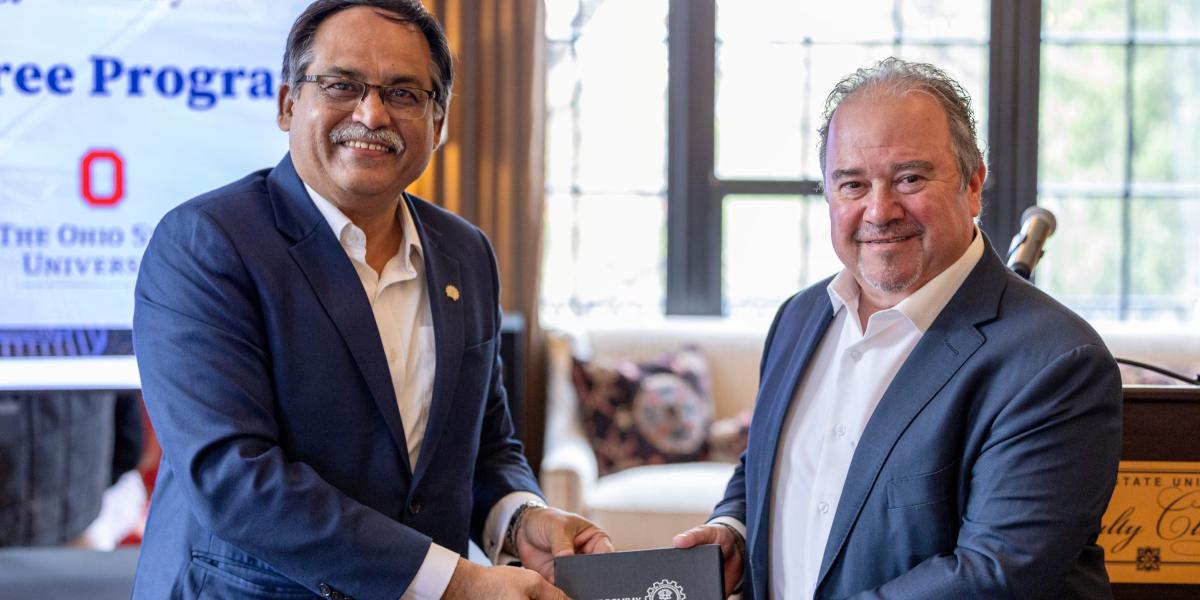 Two men shaking hands to solidify new partnership