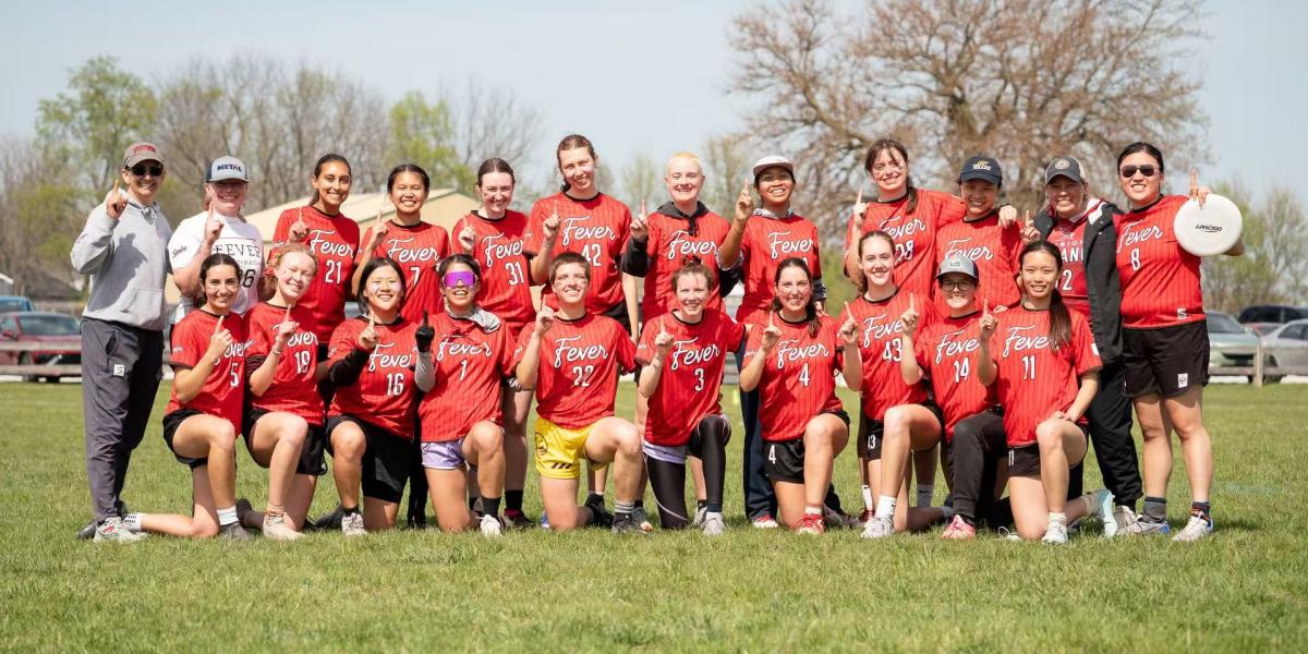 People in matching uniforms smiling