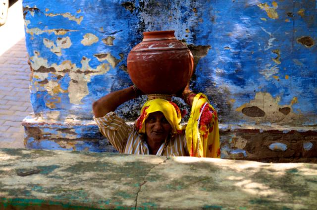 woman carrying pot