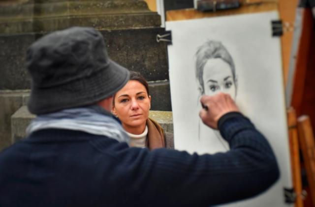 man drawing woman