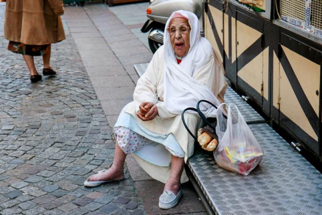 Woman sitting in street