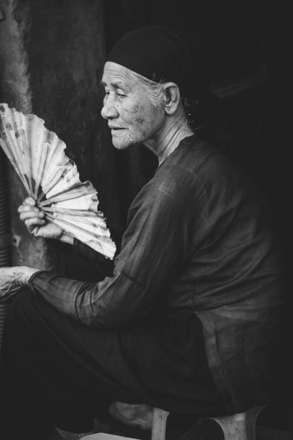 Woman holding hand fan