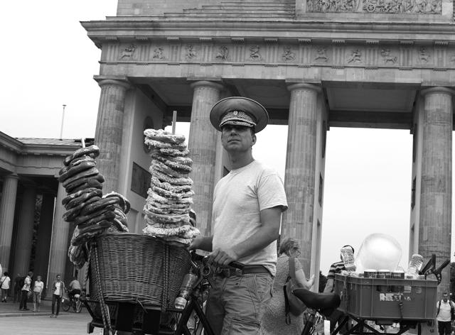 Man on bike with pretzels on sticks