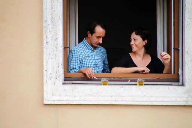 woman and man smoking a cigarette