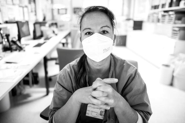 Hospital worker woman wearing a mask.