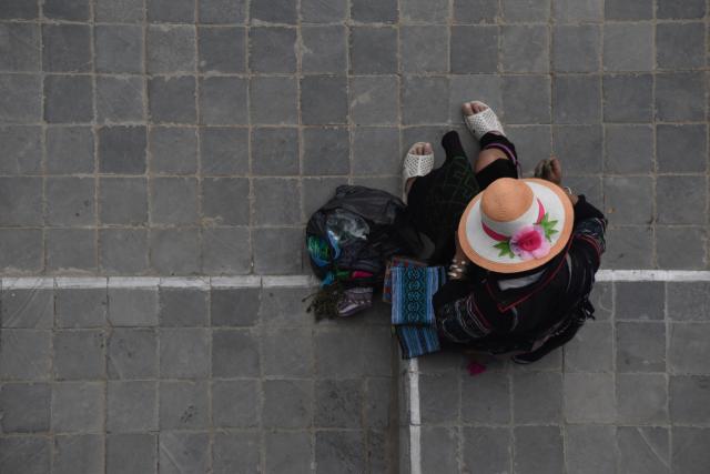 Woman sitting on road