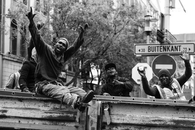 Men waving at camera