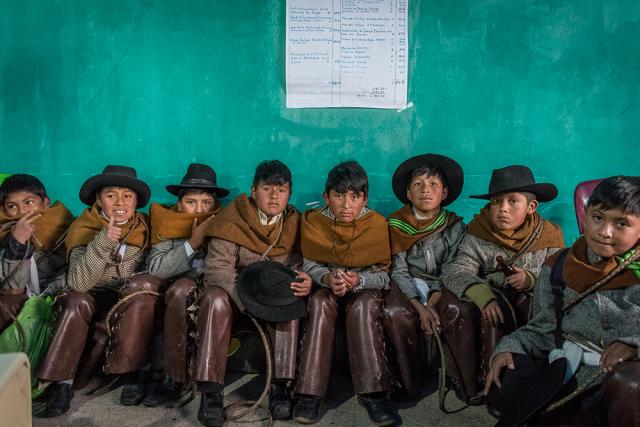 children sitting in row