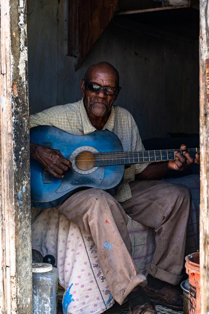 elderly couple playing guitar 