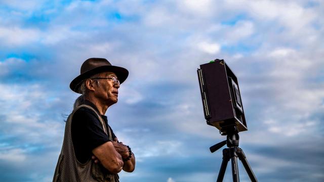 man using pinhole camera