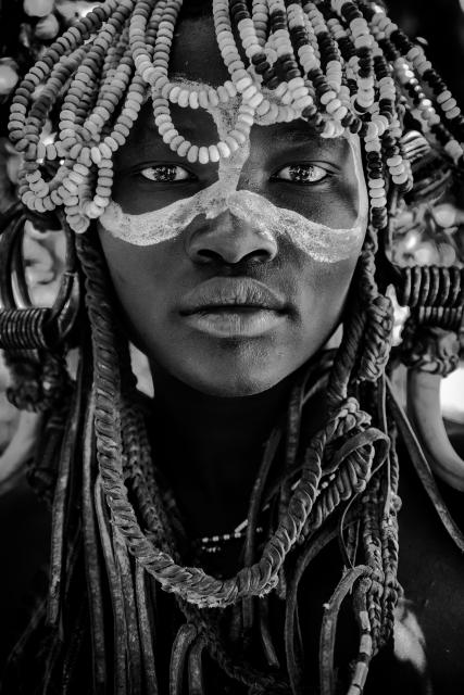 Closeup portrait of a young man in a headdress
