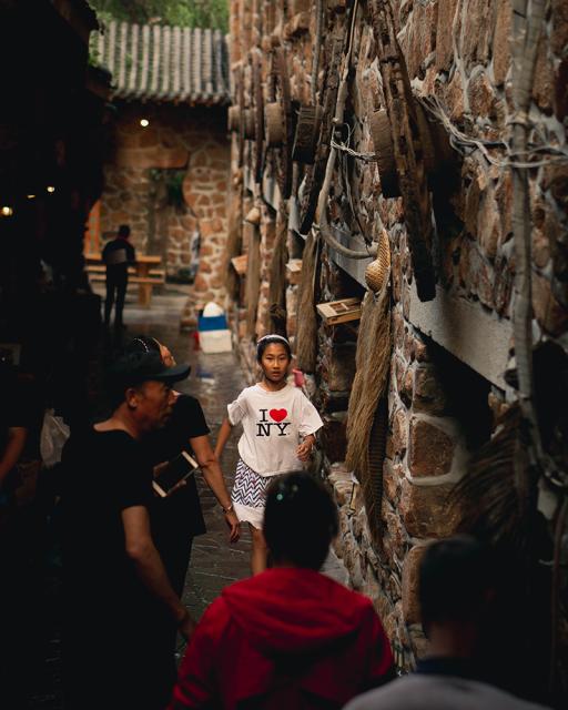 People walking in alleyway